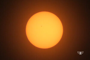 A sun with a star in the middle of it.