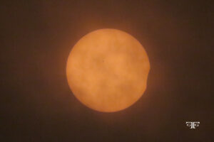 A sun is seen in the sky during an eclipse.