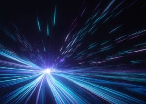 A blue and purple light trail in the dark.