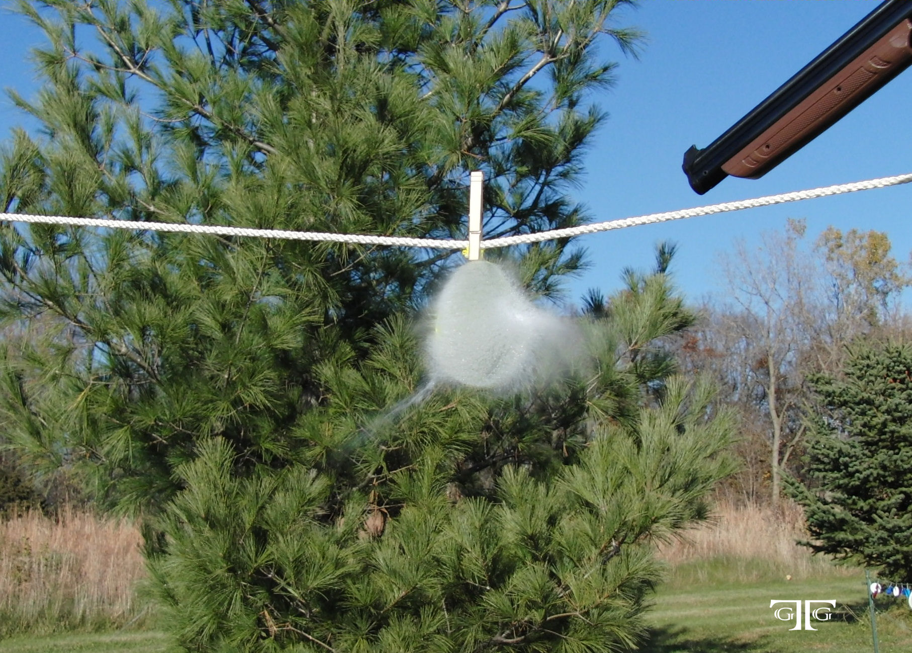 3rd Balloon - CIMG4590 Cropped 5x7 with GTG Lo A person hanging some kind of object on the line